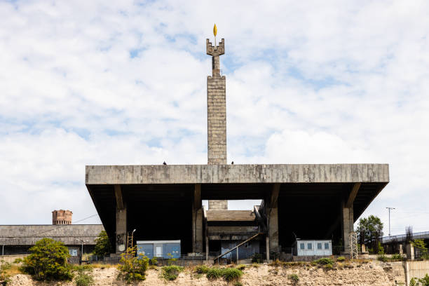 Yerevan, Armenia - July 28, 2024: bottom view of Monument in honor 50th Anniversary of October Revolution from Cascade in Yerevan city on sunny summer day