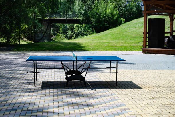 istock Outdoor ping pong table on a sunny day in a park. 2174422894