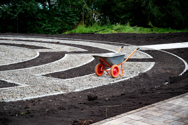 Wheelbarrow on a landscaped garden pathway..