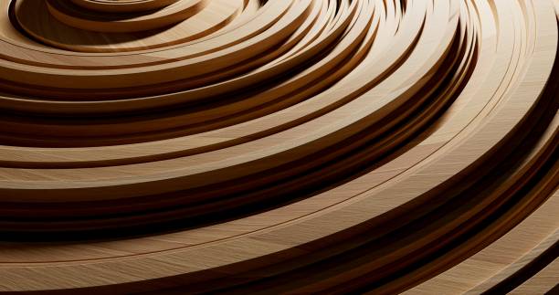 A close-up of fine wooden strips coiled in repeating circular layers stock photo
