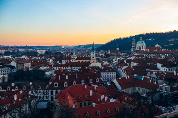 istock Sunset over Prague's charming rooftops with historic architecture glowing in the evening light 2174424718
