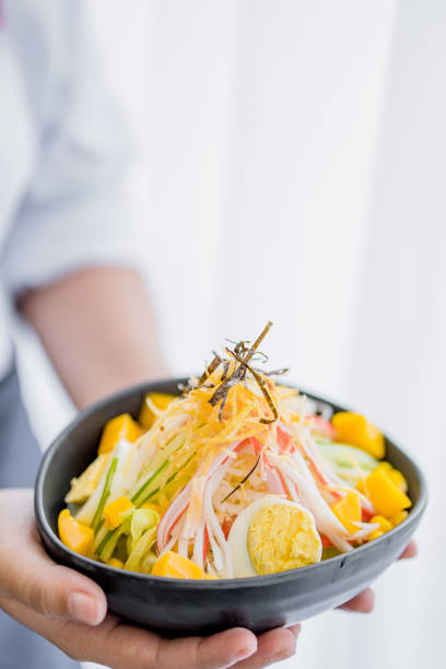 istock wait staff serving healthy salad 2174425217