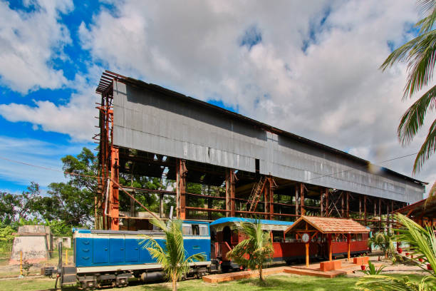istock an industrial scene with a large, weathered metal structure in the background 2174425414