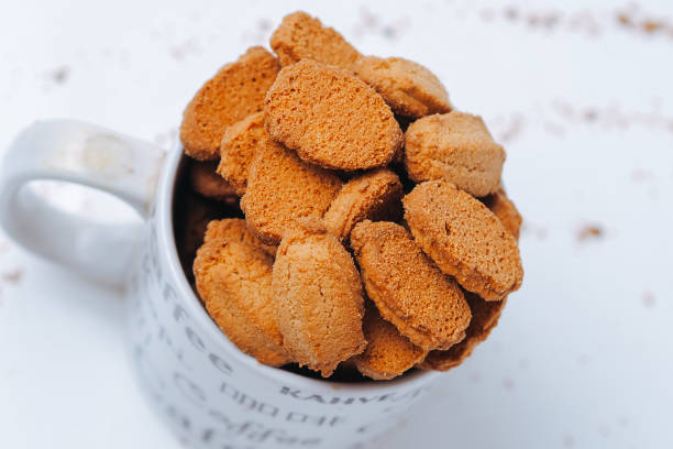 istock biscuits with coffee flavor, isolated on white background, in the glass 2174426303