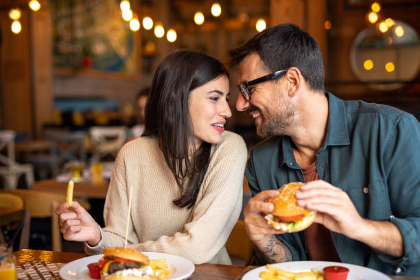 istock Happy couple enjoying lunch together 2174427459