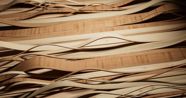 istock A detailed close-up of thin, light wood strips arranged in overlapping wavy patterns, creating a fluid, dynamic effect across a flat surface. 2174427563