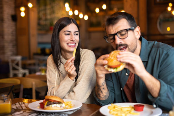 istock Happy couple having lunch in a restaurant 2174427860