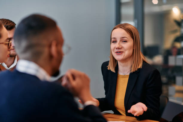 istock Businesswoman Leading Discussion in Modern Office Setting 2174428552