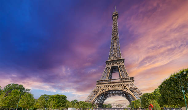 istock World famous Eiffel tower under a pink sky at sunset 2174429618