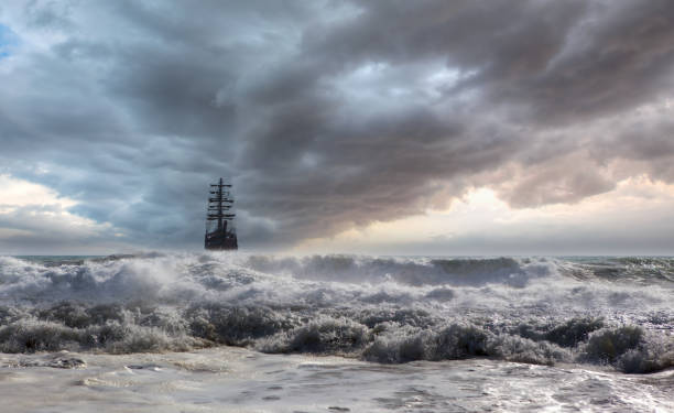 istock Sailing old ship in a storm sea in the background stormy clouds 2174430419