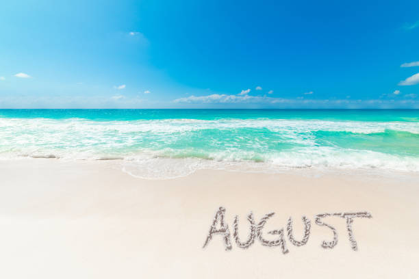 istock Tropical beach with August written on the sand 2174431451
