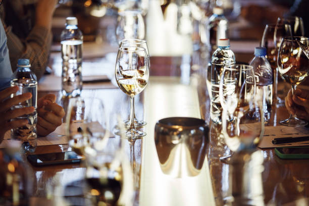 istock Sommeliers Wine Tasting Event Featuring Crystal Stemware on Polished Wooden Table 2174432511