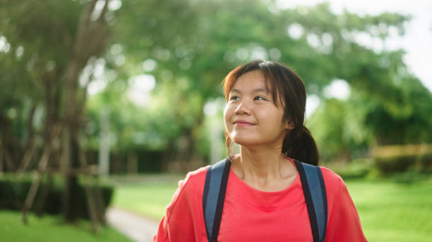 istock Teenager walking at park. 2174438825