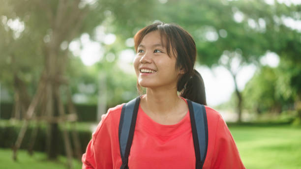 istock Teenager walking at park. 2174438828