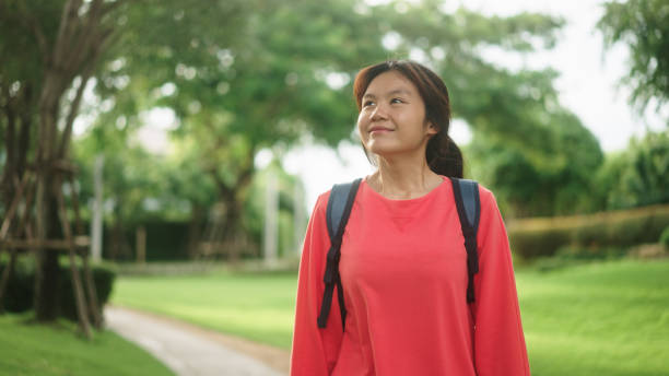 istock Teenager walking at park. 2174438908