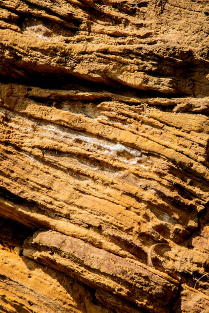istock Sandstone rock wall filling the frame. 2174439955