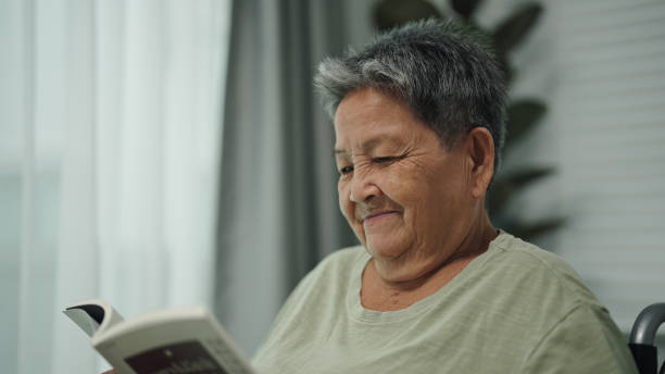 istock Senior woman reading a book. 2174440118