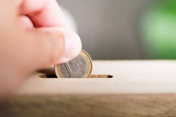 istock Saving a 1 euro coin 2174444235