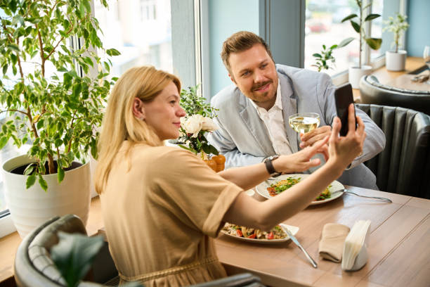 istock Couple taking selfie during lunch 2174444665