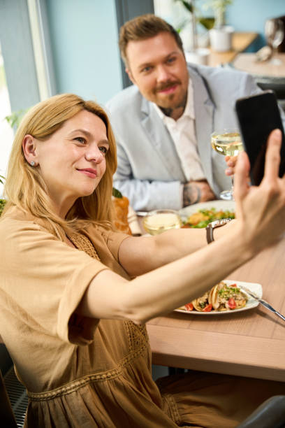 istock Married couple takes a selfie during lunch 2174444669