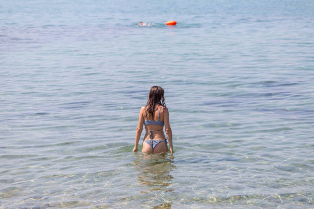 istock Summer holyday on the beach woman 2174445714