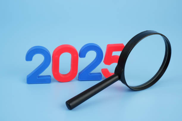 istock Magnifying glass and numbers 2025. 2174449032