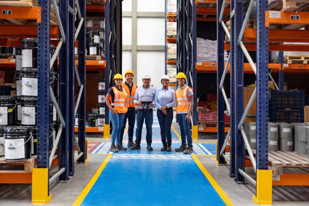 istock Group of employees working at a distribution warehouse 2174449744