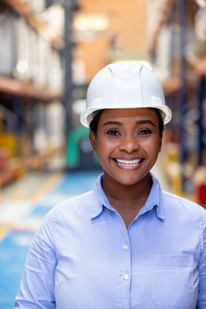 istock Woman working as a supervisor at a distribution warehouse and smiling 2174449974