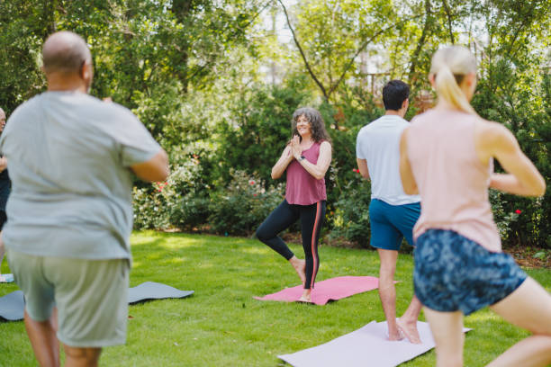 istock Diverse Participants Engage in Outdoor Yoga Session 2174450937