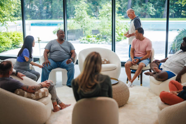 istock Sobriety Celebration at Rehab Center with Diverse Group and Cupcake 2174451054
