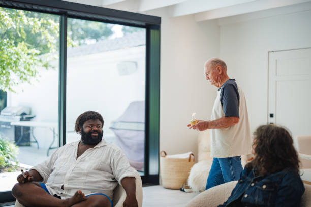 istock Sobriety Celebration at Rehab Center with Diverse Group and Cupcake 2174451350