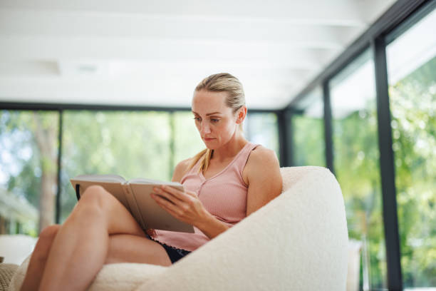 istock Focused Woman Journaling in Rehab Facility 2174451406
