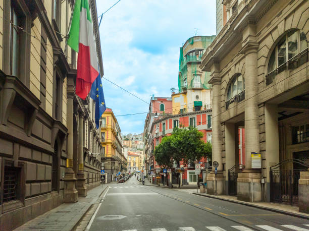 istock Elegant avenue in downtown Naples under a cloudy sky 2174452115