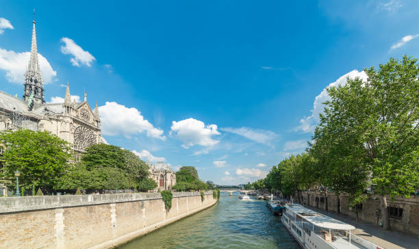 istock Notre Dame cathedral by Seine river on a sunny day 2174452189