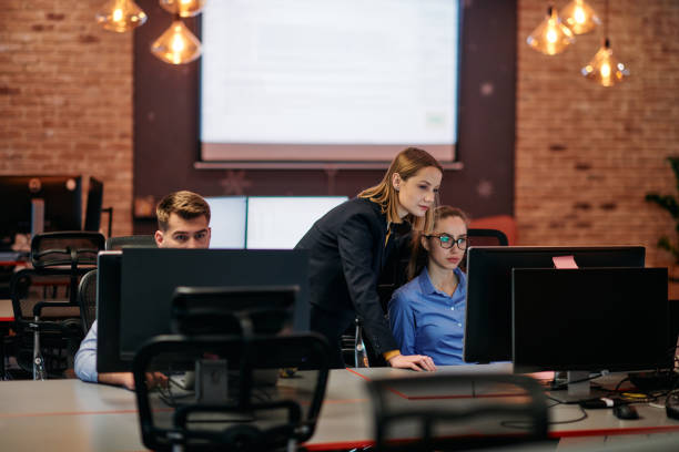 istock Strategic Business Meeting: Group of Professionals Collaborating in Office Using Computers 2174453216