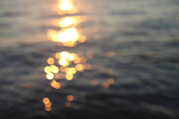 Soft, defocused image of the sun as it sets in Powell River, Sunshine Coast BC, on a summer night