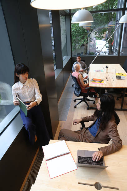 istock Group of business people in office 2174455514