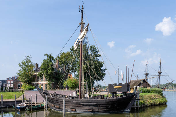 View of the Dutch East Indiaman ship beside the National Maritime Museum at summer sunset, Oosterdok, Amsterdam, The Netherlands.