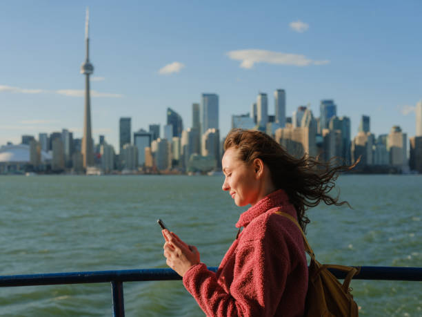 istock Woman using smartphone on the move in Toronto 2174457910