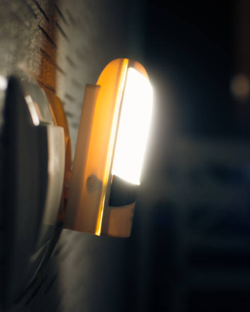 istock Special device connects power source and lit only when its dark at night to see switch for night walkers solution concept 2174457937
