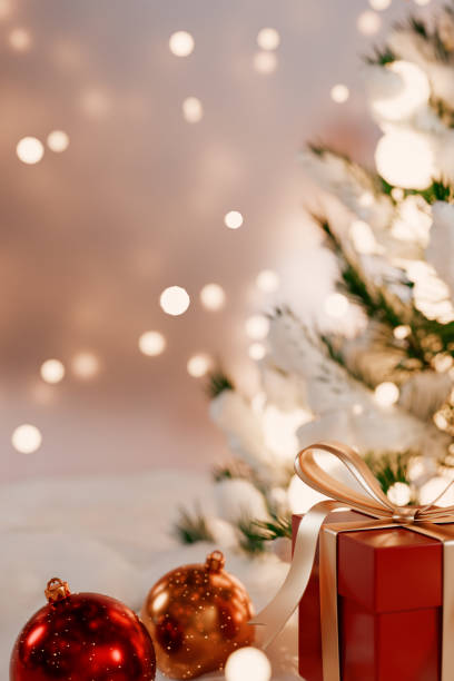 Christmas decorations with a festive tree, ornaments, and a beautifully wrapped gift. 3d rendering