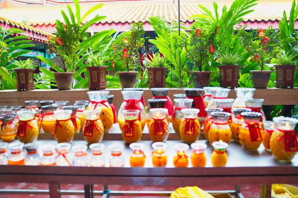 Bokeh soft focus image of Prayer candles,tea lights and votive offerings at the Five Directions Buddha Great Hall at the Kek Lok Si Temple in George Town,Penang,Malaysia
