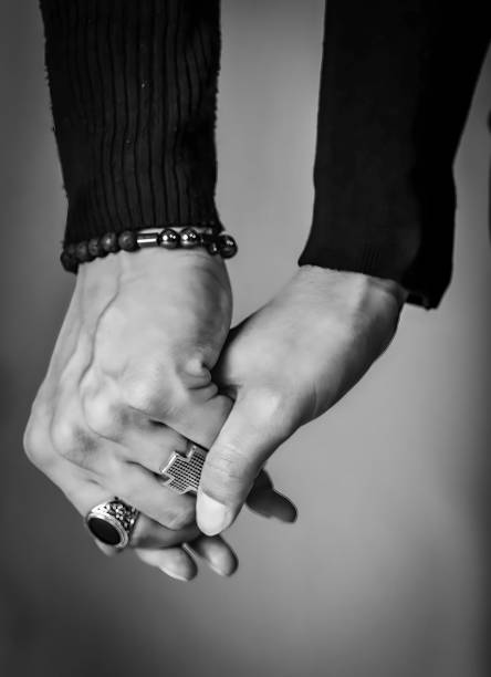 Hands holding together, man and woman