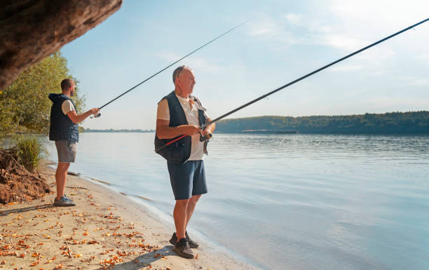 istock Father and son fishing together 2174459754