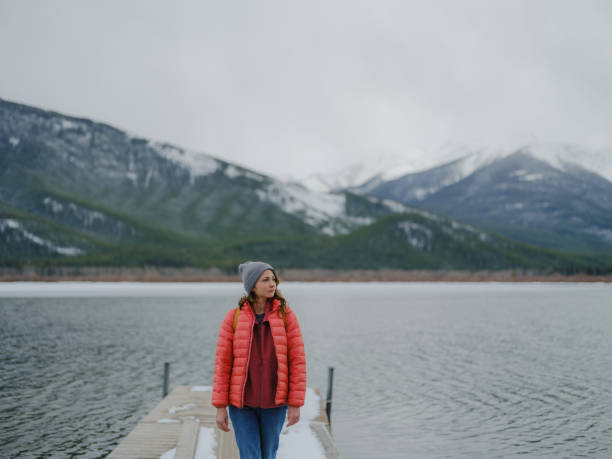istock Woman exploring Two Jack Lake in Banff in winter 2174461189
