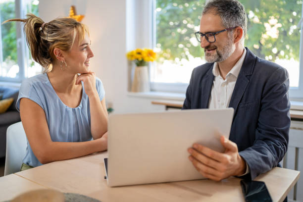 istock A financial advisor helps a young entrepreneur plan future investments. 2174463464