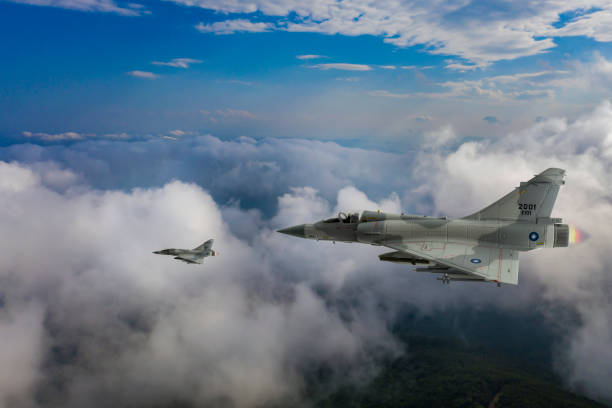 istock Jet aircrafts flying over the clouds. 2174464440