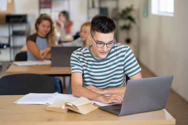 istock An university student is working on laptop in a library 2174464859