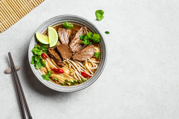 istock Pho Bo Vietnamese soup with rice noodle and beef 2174469099