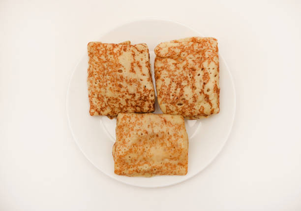 Pancakes with meat on a white plate. Pancakes with filling.